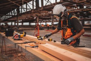A woodworker cutting wood to represent what is a safety file.